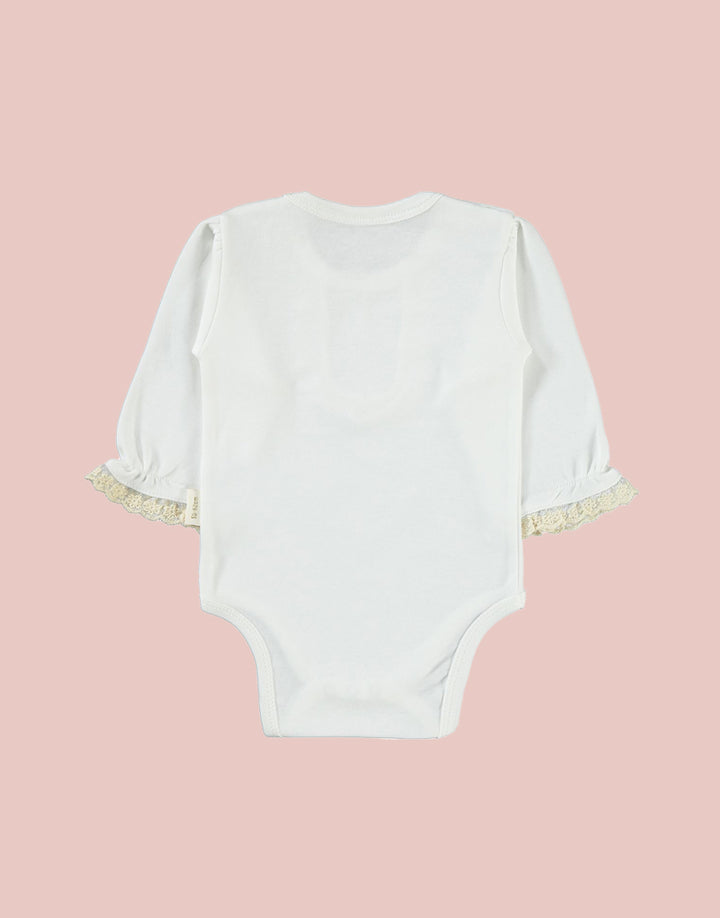 Our bodysuits feature a delightful frill collar and cuff detailing, adding a touch of whimsy to your baby's wardrobe. The intricate coloured embroidery on the ruffle collar lends a pop of color and personality, available in your choice of pink or beige