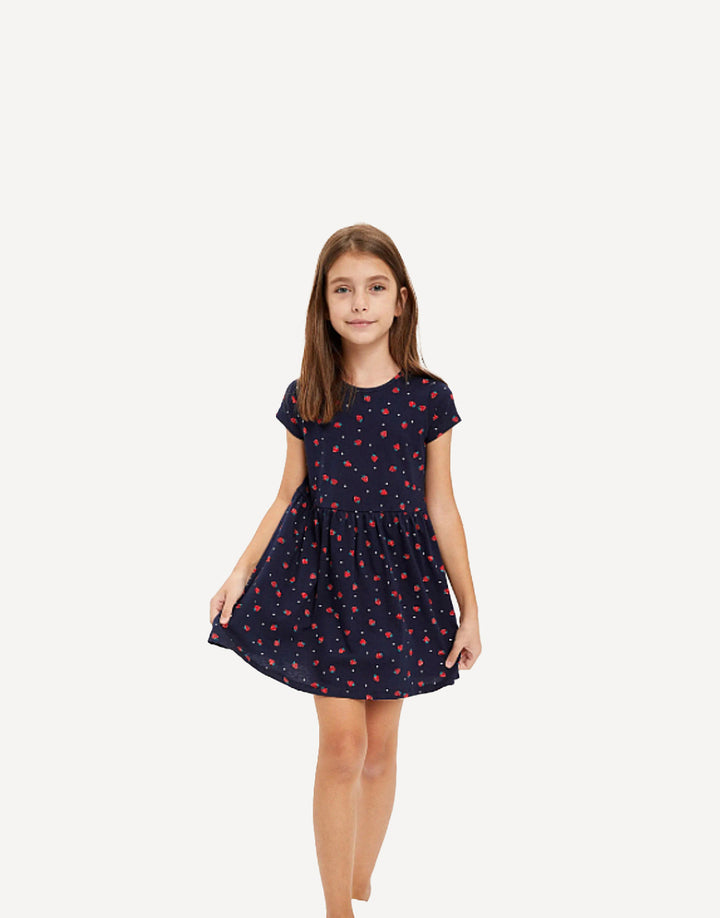 Girl wearing strawberry ditsy print summer dress